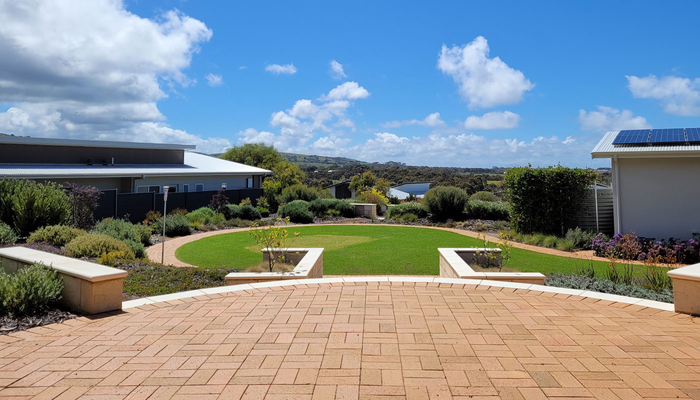Curved paved patio overlooking a circular lawn in Victor Harbor