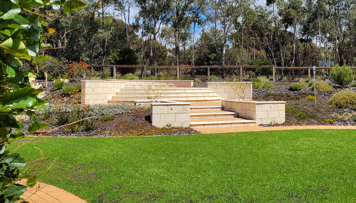 Broad stone steps and retaining walls above a lawn in Victor Harbor